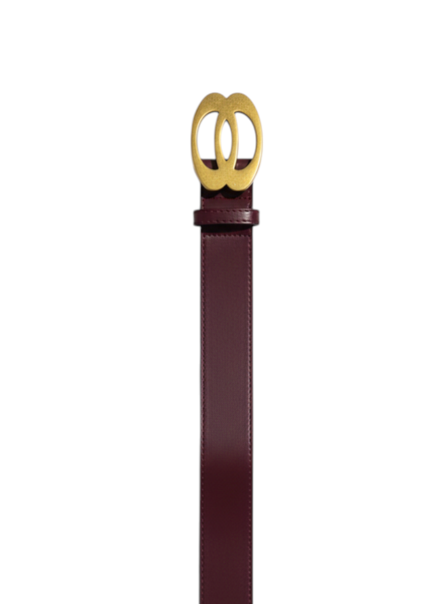 ROXANZ burgundy leather belt with gold circular interlocking buckle. Minimalist style, perfect for women's fashion.